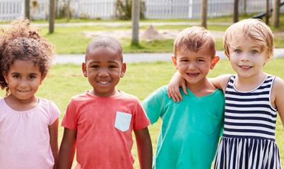 Children standing outdoors.